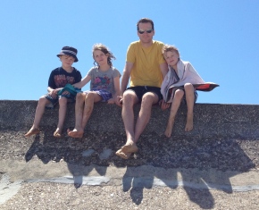 Family on the seawall at Saint-Laurent-Sur-Mer