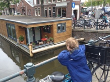 William watching a houseboat in Amsterdam