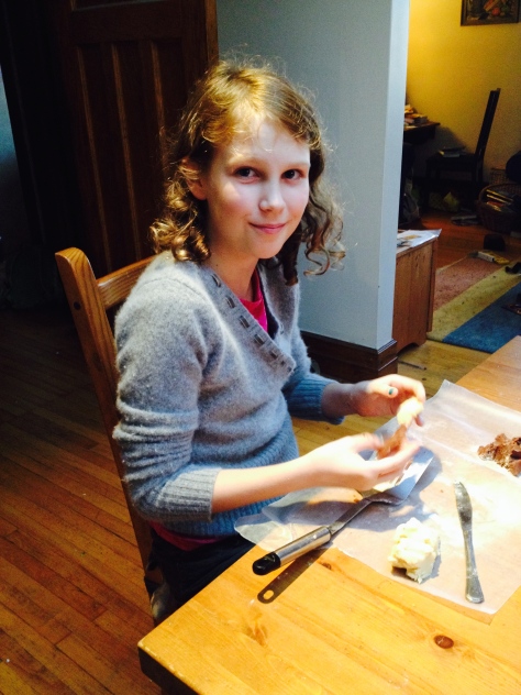 Charlotte making Minecraft- and Pokemon-shaped cookies